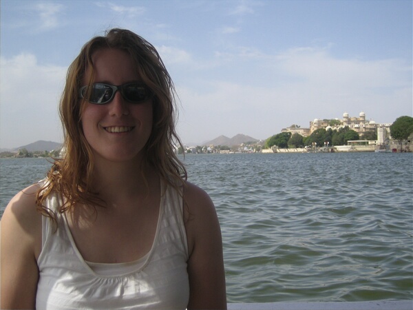 Tracy on a boat with the City Palace behind