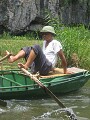 Rowing with his feet. Tam Coc, Vietnam
